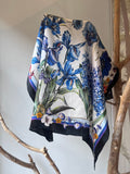 Silk scarf for women 90x90 cm with blue floral design, elegant square scarf with black border, luxury silk accessory for neck, hair or handbag, versatile scarf that changes look depending on how tied, Šilkinė skarelė moterims 90x90 cm su mėlynomis gėlėmis, elegantiška kvadratinė skarelė su juodu rėmeliu, prabangus šilko aksesuaras kaklui, plaukams ar rankinei, universalus aksesuaras, kuris atrodo skirtingai užrištas.